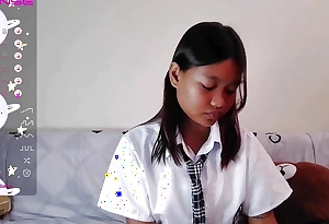 Oriental Schoolgirl web camera stance